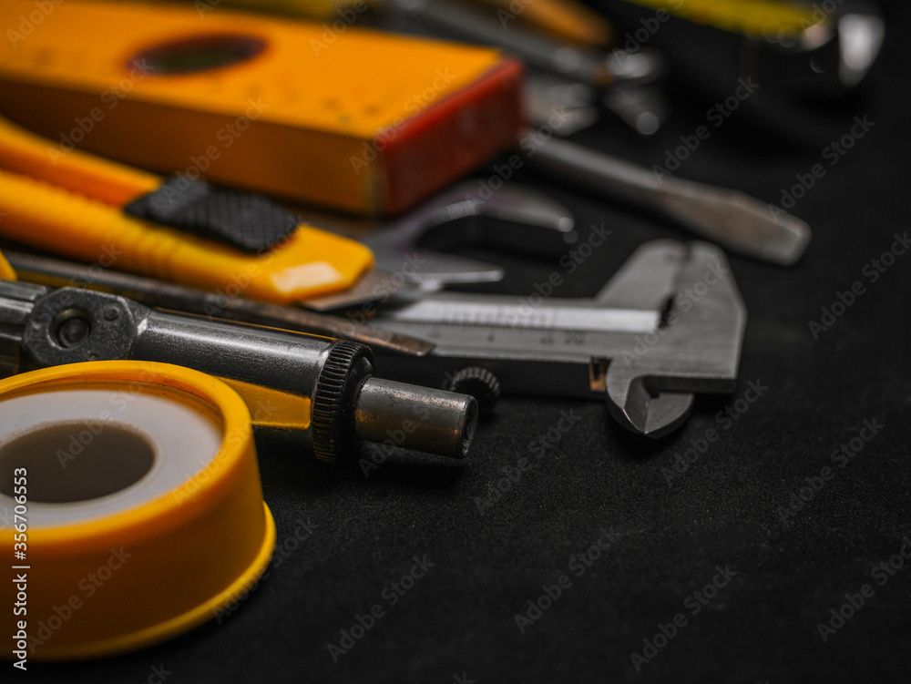 Fototapeta premium Background of various construction tools. Building tools repair set on black background. Copy Space