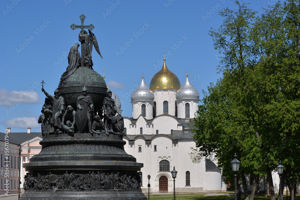 Veliky Novgorod. Russia. Monument to the Millennium of Russia against the backdrop of St. Sophia Cathedral and blue sky. Novgorod Kremlin. Summer view. Novgorod detinets
