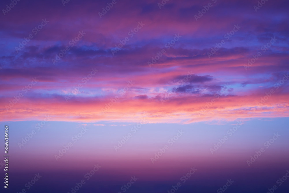 sunset purple clouds with shades of blue and orange