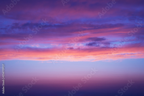 sunset purple clouds with shades of blue and orange