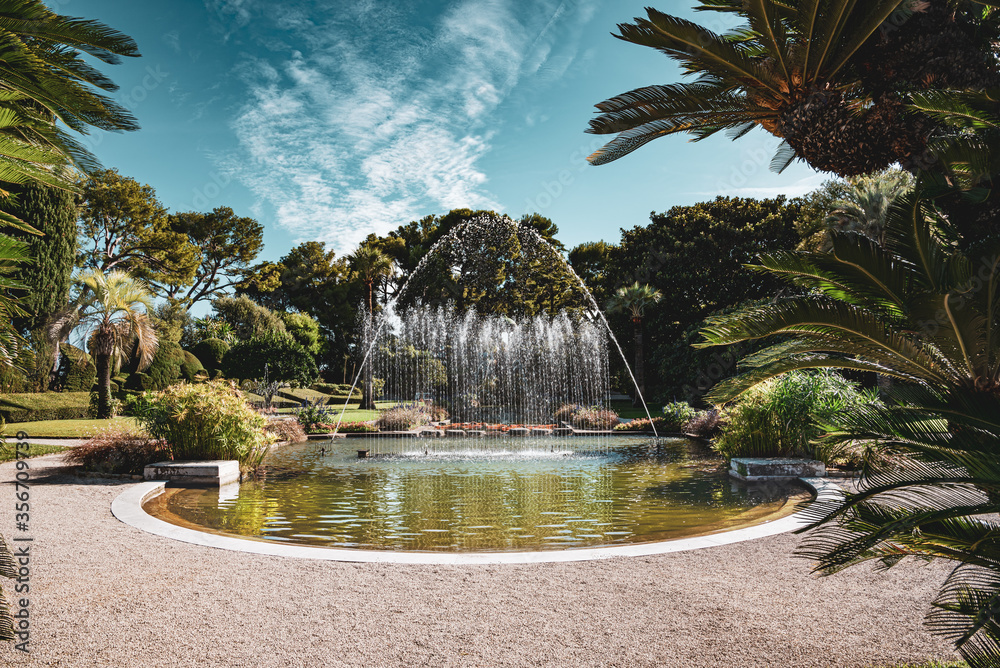 A beautiful garden fountain of Villa Ephrussi de Rothschild in a sunny day
