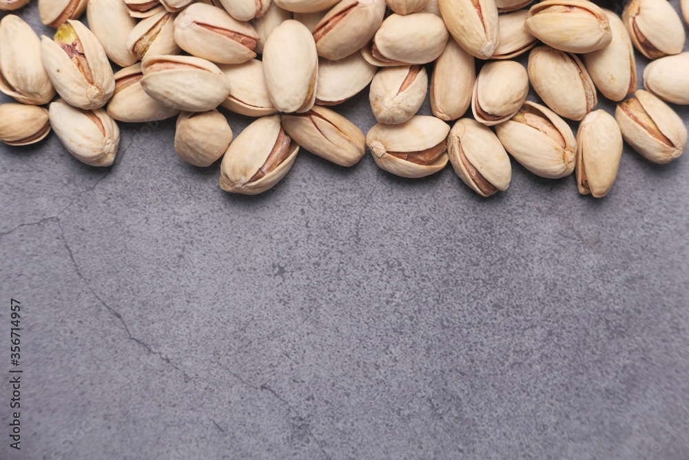 high angle view of pistachios nut on gray background high angle view of pistachios nut on gray background