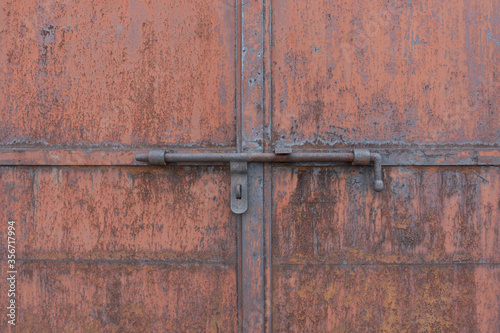 Old rusty metal closed door background texture