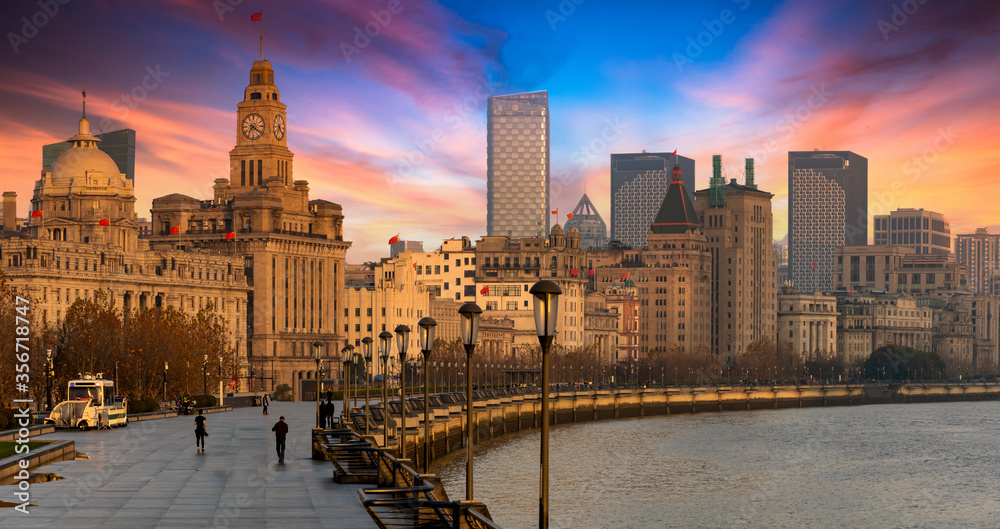 Shanghai The Bund historical old colonial buildings, Shanghai city skyline and skyscraper, sunrise on The Bund, China.