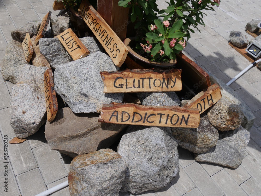 Φωτογραφία Close up of the Seven Deadly Sins written on wood infront of St