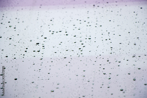 Rain drops on the glass background