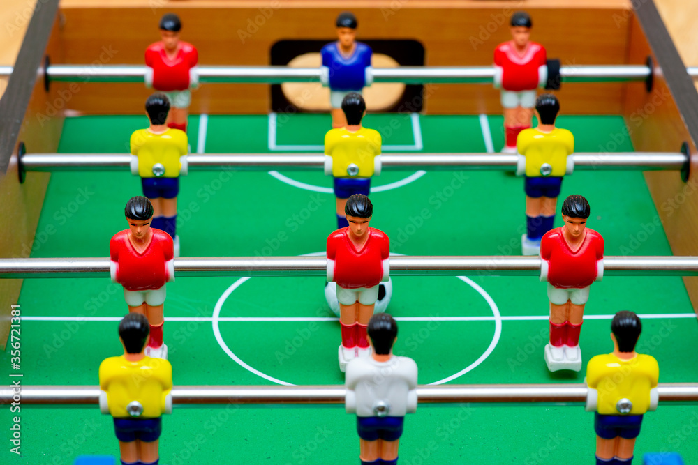Close up table soccer with players and a ball. Close up table soccer with players and a ball.