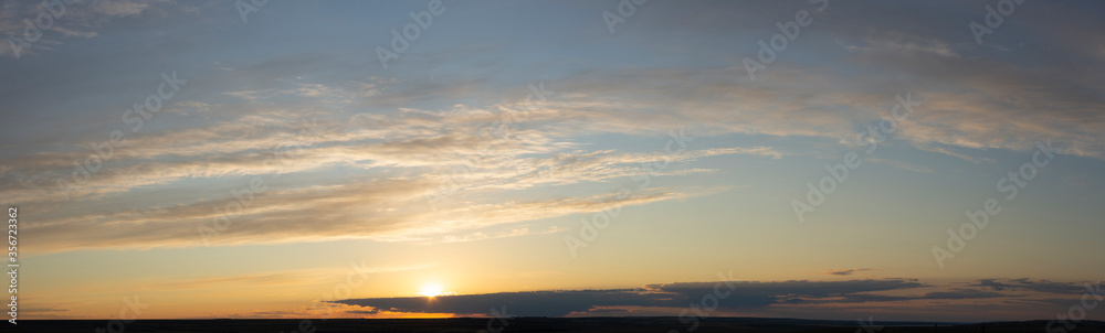 Epic landscape at sunset. Tragic gloomy sky. Fantastic skies on the planet earth. Crimson twilight. Panorama. Epic landscape at sunset. Tragic gloomy sky. Fantastic skies on the planet earth. Crimson twilight. Panorama.
