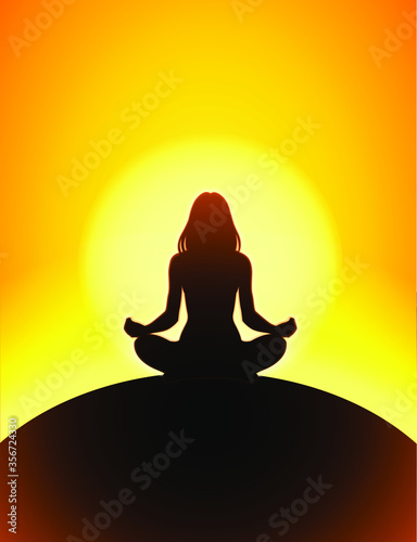 silhouette of a woman meditating in yoga pose with sun disk in the background