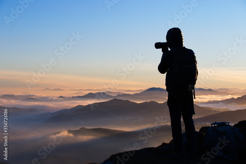 Munitibar, Bizkaia/Basque Country; Jan. 04, 2019. Photographer taking the sunrise from the top of Mount Oiz. A morning of a lot of fog and some beautiful colors