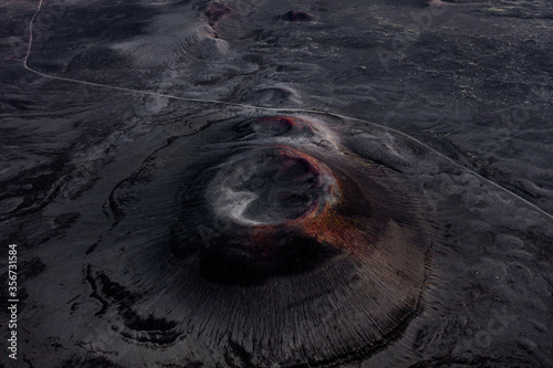 Aerial view of black and red volcanic craters, making the Icelandic landscape looking like the surface of another planet, Central Highlands, Iceland photo