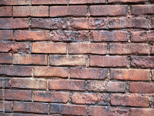 Red brick wall with an age effect