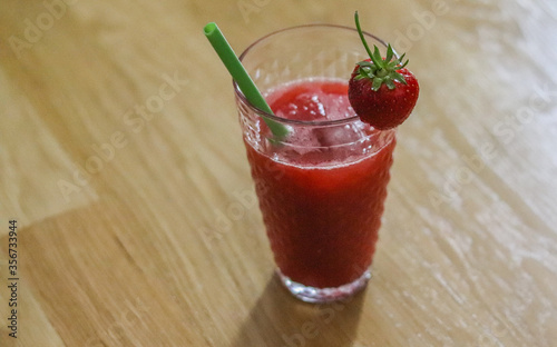 Strawberry alcoholic drink with ice