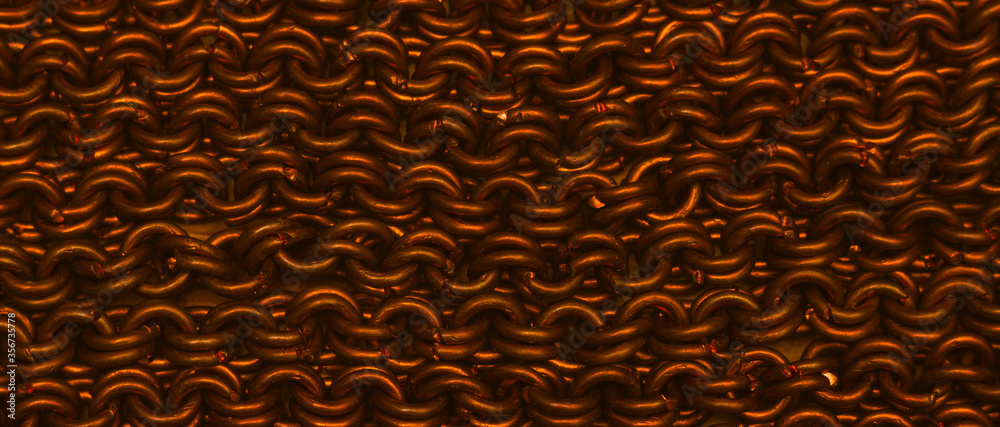 Wicker cooper chain closeup shot. Texture background Wicker cooper chain closeup shot. Texture background