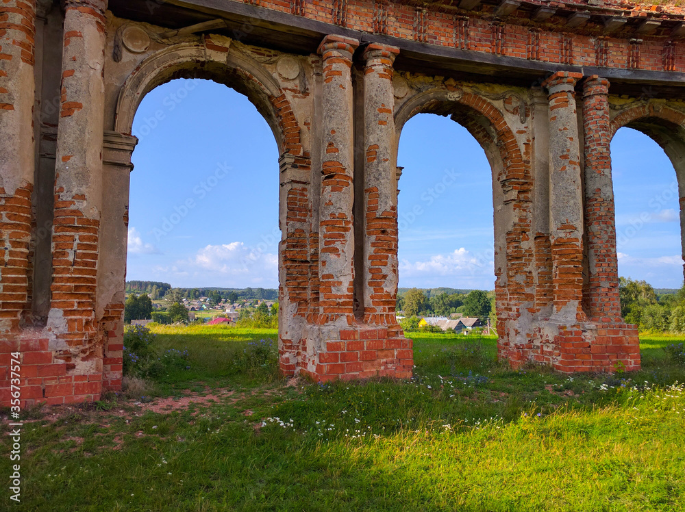 ruins of an old castle on a green meadow