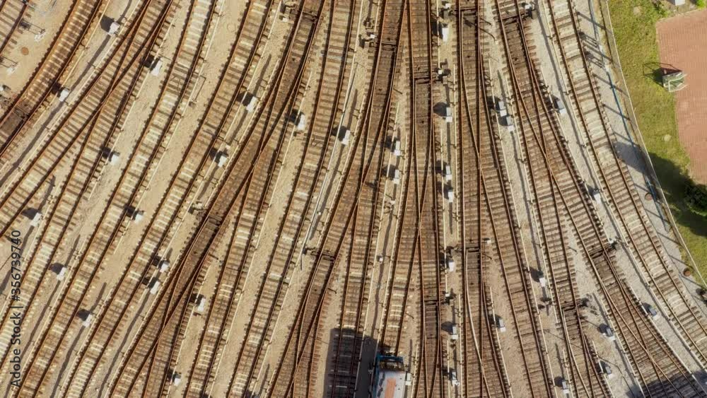 Flight over passenger train carriage at railway station. Aerial view of railroad rail yard Flight over passenger train carriage at railway station. Aerial view of railroad rail yard