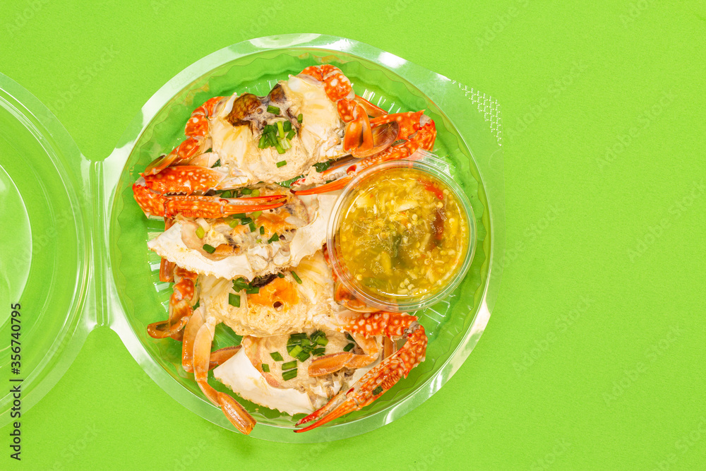.Fresh steamed crab select crab claw on a plate with seafood sauce ready to serve. .Fresh steamed crab select crab claw on a plate with seafood sauce ready to serve.