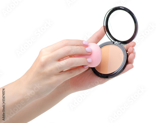 Powder with puff beauty in hand on white background isolation