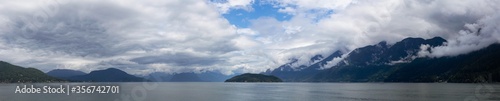 Beautiful Panoramic Canadian Landscape view of Howe Sound during a cloudy and sunny day. Taken near West Vancouver, British Columbia, Canada. Nature Background Panorama © edb3_16
