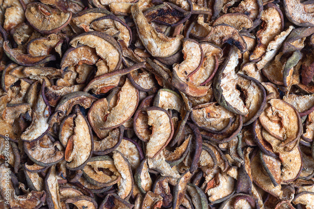 Scattered dried apple and pear slices texture. Pattern, dried slices background, texture close-up Scattered dried apple and pear slices texture. Pattern, dried slices background, texture close-up