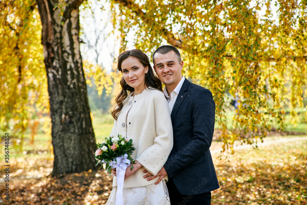 Young male and woman just married. Concept of happy family. Modern family outdoor. Young male and woman just married. Concept of happy family. Modern family outdoor.