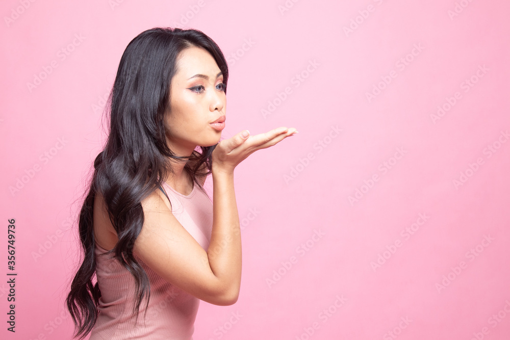 Beautiful young Asian woman blow a kiss. Beautiful young Asian woman blow a kiss.