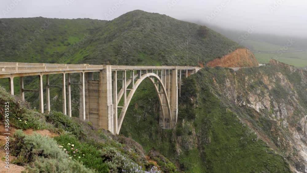 Ultra slow motion shot of famous Bixby Creek Bridge in California, USA - camera panning right Ultra slow motion shot of famous Bixby Creek Bridge in California, USA - camera panning right