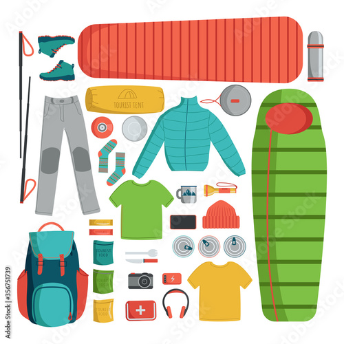 A set of tourist items arranged on a horizontal surface in the shape of a square. The contents of a tourist backpack. Clothing, sleeping bag, travel mat, dishes, camera, backpack, travel food.