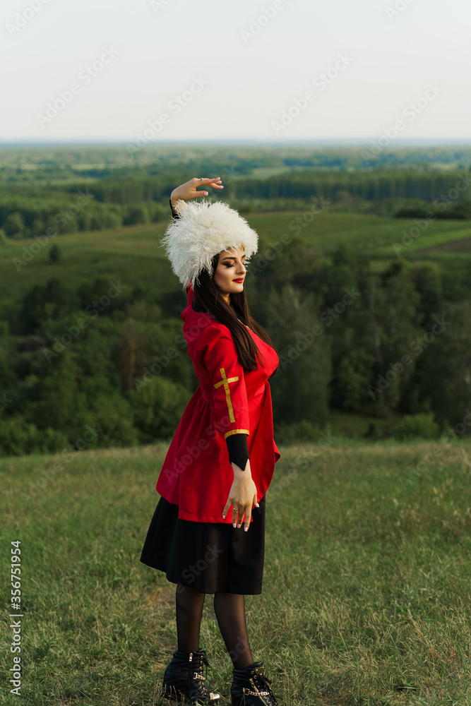 Georgian girl in white papakha and red 