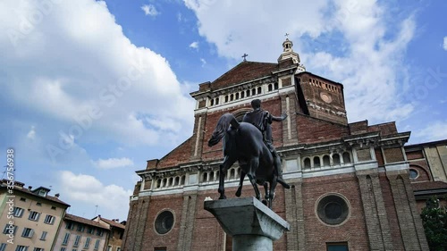 Timelapse of Renaissance Catholic Cathedral of Pavia (Duomo di Pavia) and Regisole Monument in a cloudy day
