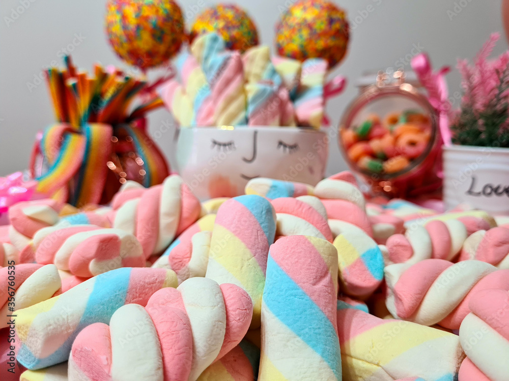 Delicious stuffed and colorful marshmellos, making a beautiful party table.