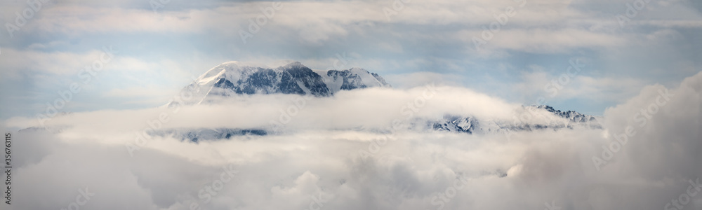 Mountain peaks in the clouds Ile Alatau National Park Tien Shan