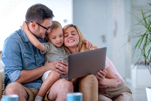 Family using laptop at home