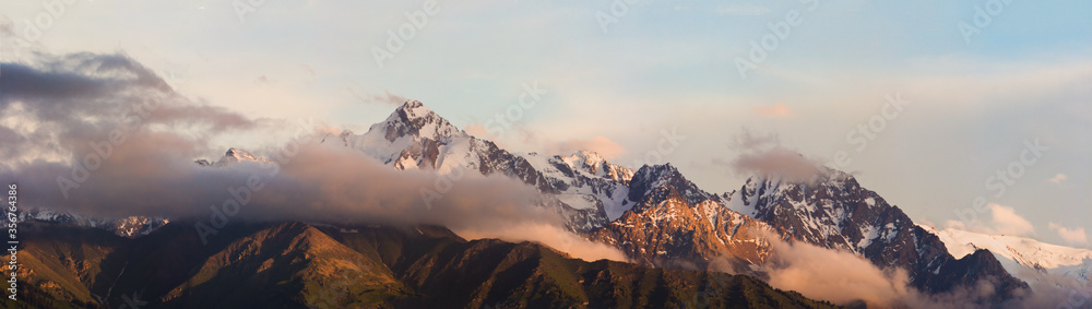 Mountain peaks in the clouds Ile Alatau National Park Tien Shan