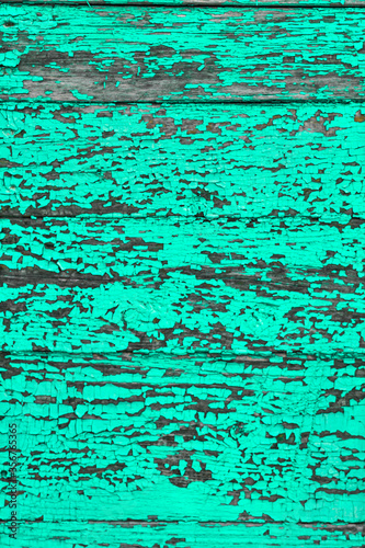 turquoise wall from vertically and horizontally laid boards