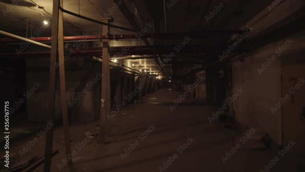 Walking quickly through a dark basement tunnel Walking quickly through a dark basement tunnel
