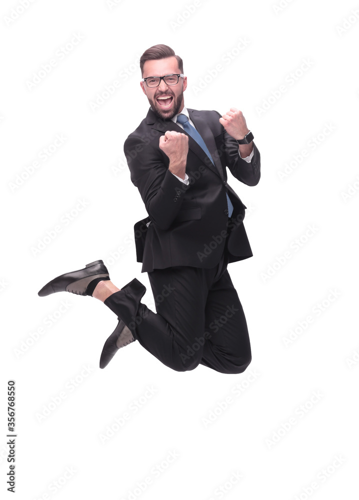 in full growth. happy dancing young businessman in full growth. happy dancing young businessman