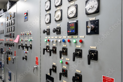 Bild auf Leinwand An electrical generation panel with buttons, gauges and switches