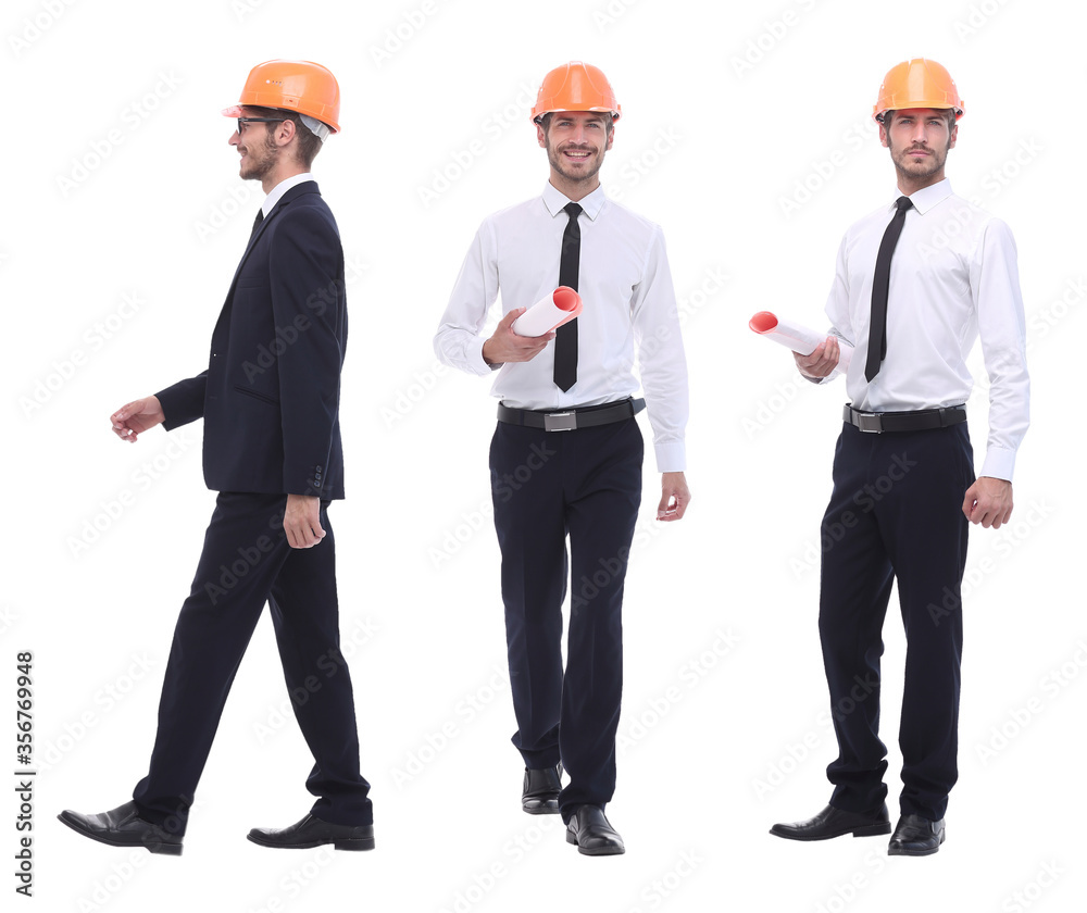 in full growth .a qualified architect in an orange helmet in full growth .a qualified architect in an orange helmet