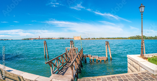 Photos Panoramic view over busy Grand Canal and pier, promenade embankment at Lido isla