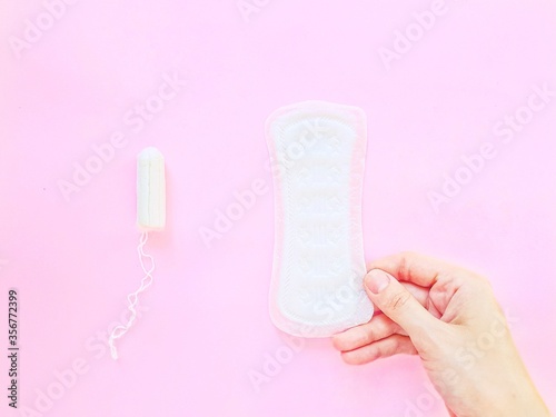 Intimate feminine hygiene products. The daily tampon and sanitary pads. Menstrual cycle.