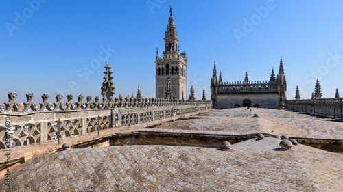 La Giralda - A rooftop view of top of La Giralda and details of the ribbed vaults from the Central Nave on the roof of Seville Cathedral. Seville  Andalusia  Spain.