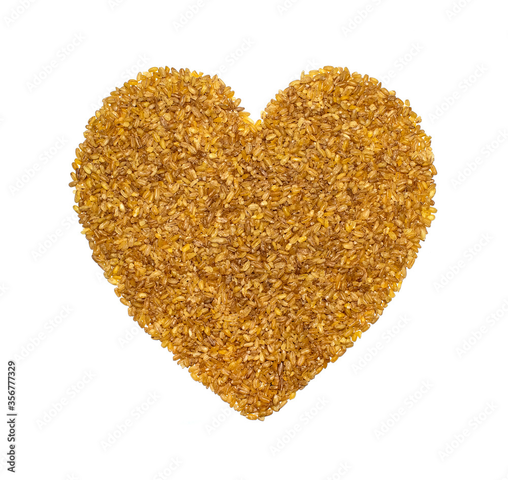 bulgur grains in the form of a heart on a white background as a symbol of healthy nutrition for vegans and vegetarians bulgur grains in the form of a heart on a white background as a symbol of healthy nutrition for vegans and vegetarians