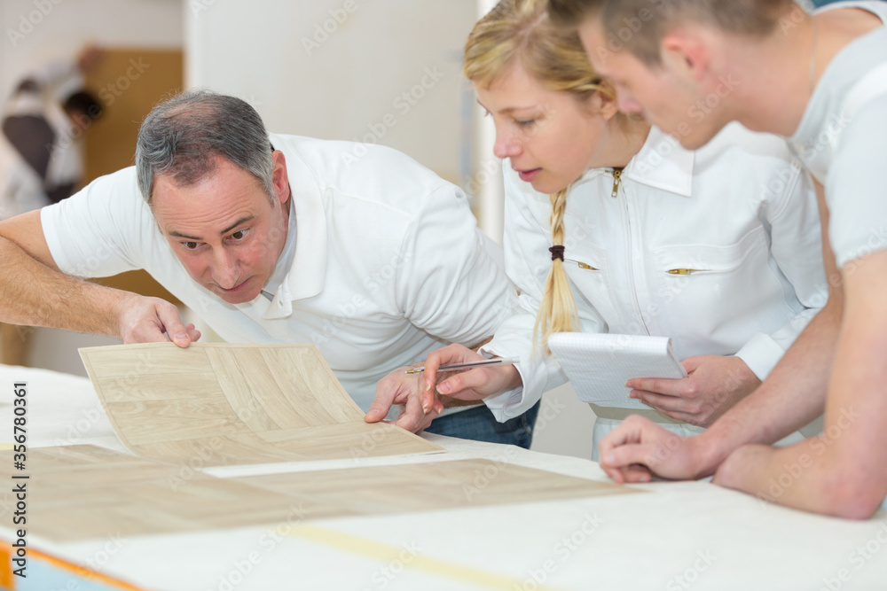 students learning the technique of wall paper students learning the technique of wall paper