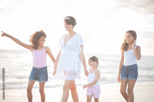 family walks at the beach