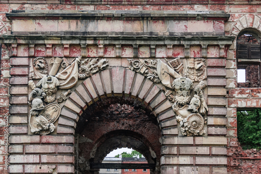 A detail of a crumbling neo-Renaissance entrance gate, Nowy Dwór Mazowiecki, Poland