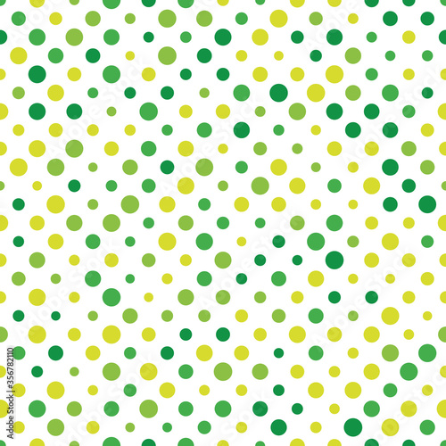 Seamless polka dot pattern. Green dots in random sizes on white background. Vector illustration