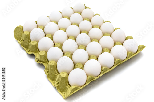 White eggs cartoon box on white background. Cartela com ovos. photo