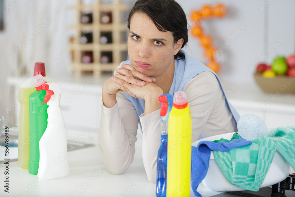 upset woman with cleaning products upset woman with cleaning products