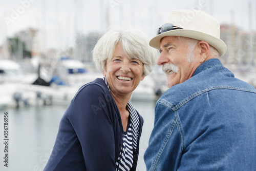 Canvas Print portrait of senior couple at a harbour